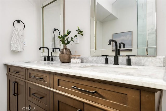 full bathroom featuring double vanity and a sink