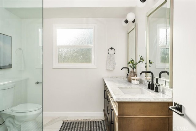 bathroom with toilet, marble finish floor, baseboards, and vanity