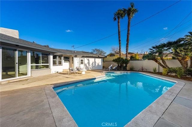 view of swimming pool with fence private yard, a fenced in pool, and a patio