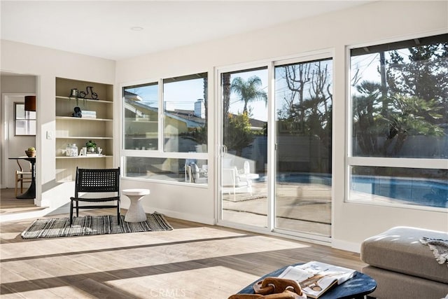 interior space with wood finished floors and baseboards