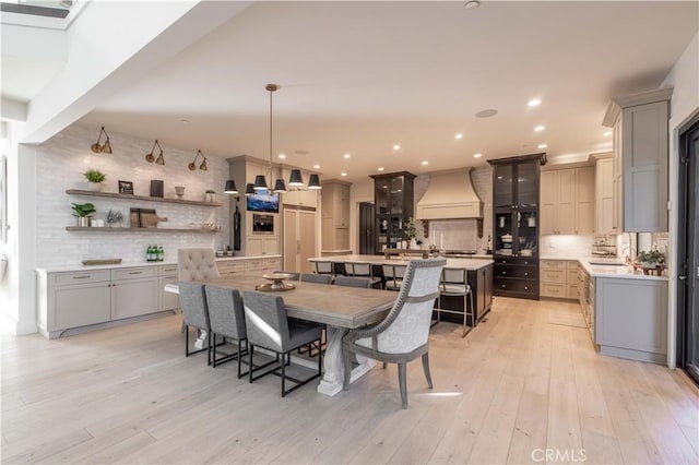 dining space featuring light wood-style floors and recessed lighting