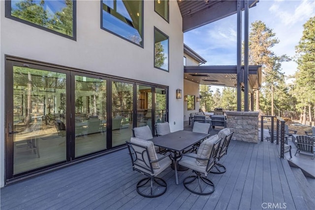 wooden deck with outdoor dining space