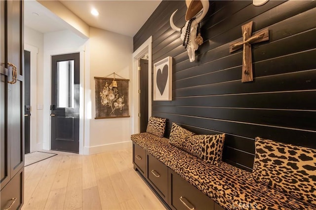 mudroom with light wood-style flooring and baseboards