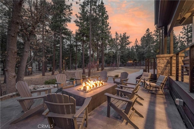 patio terrace at dusk with an outdoor fire pit