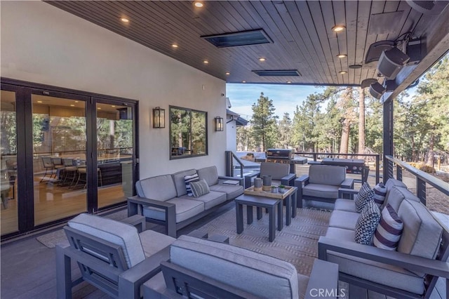 view of patio with outdoor lounge area and visible vents