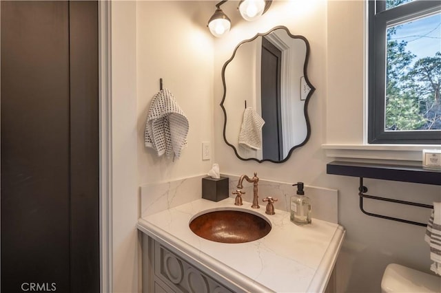 half bath with vanity and toilet