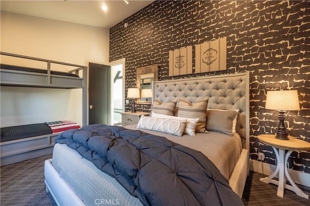 bedroom with carpet flooring and a towering ceiling