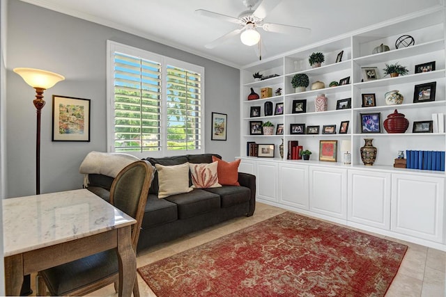 living room with crown molding, ceiling fan, built in shelves, and light tile patterned floors