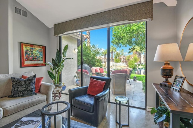 living room featuring lofted ceiling