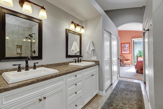 bathroom featuring an enclosed shower, vanity, and tile patterned floors