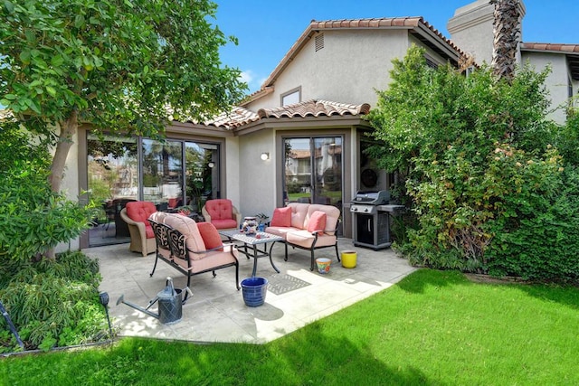 rear view of house with a yard, outdoor lounge area, and a patio area