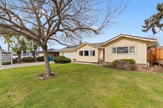 single story home with a garage and a front yard