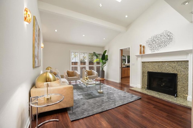 living room with wood-type flooring, high vaulted ceiling, a fireplace, and beam ceiling