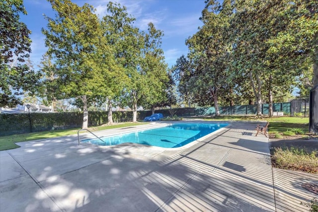 view of swimming pool with a patio