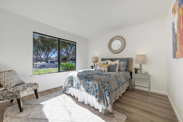 bedroom with hardwood / wood-style flooring