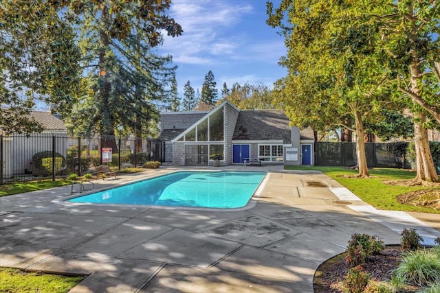 view of swimming pool with a patio