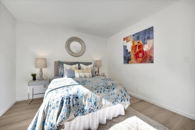 bedroom with light hardwood / wood-style floors