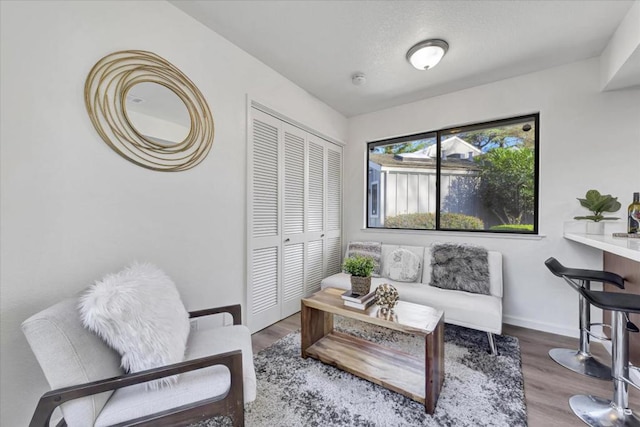 living area with hardwood / wood-style floors