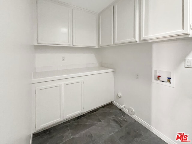 laundry room featuring cabinets, washer hookup, and hookup for a gas dryer