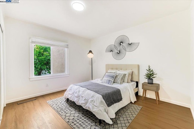 bedroom featuring wood-type flooring