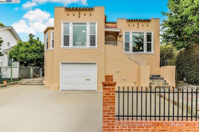 mediterranean / spanish-style house featuring a garage