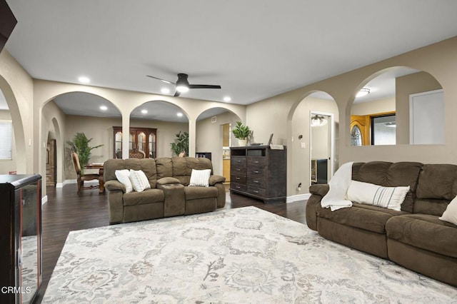 living room with dark wood-type flooring, wine cooler, and ceiling fan