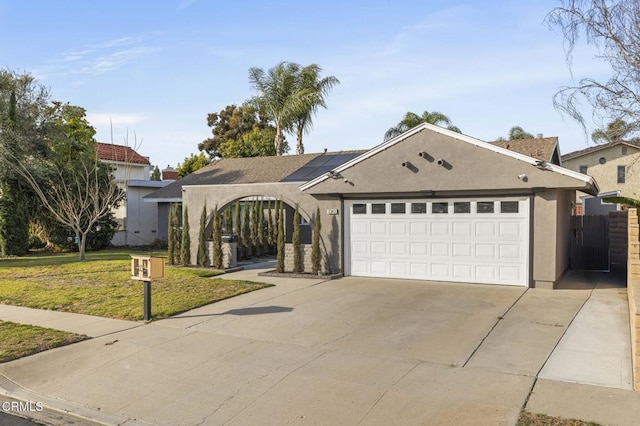 view of front of property with a garage and a front yard