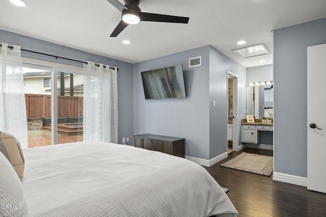 bedroom featuring ceiling fan, connected bathroom, access to exterior, and dark hardwood / wood-style flooring