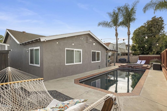 view of pool featuring an in ground hot tub and a patio area