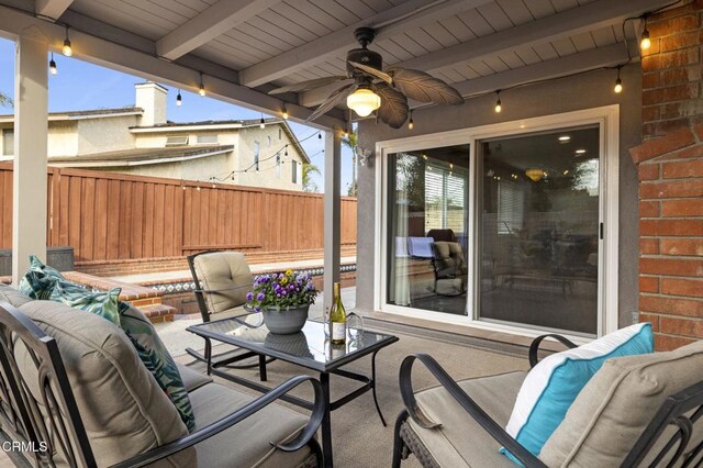 view of patio featuring an outdoor hangout area and ceiling fan