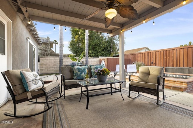 view of patio with an outdoor living space and ceiling fan