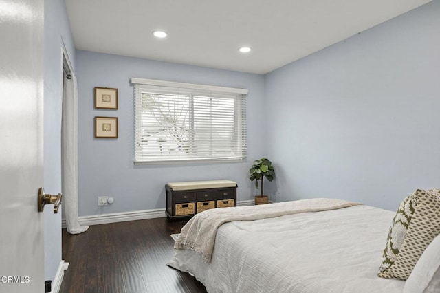 bedroom featuring dark hardwood / wood-style flooring