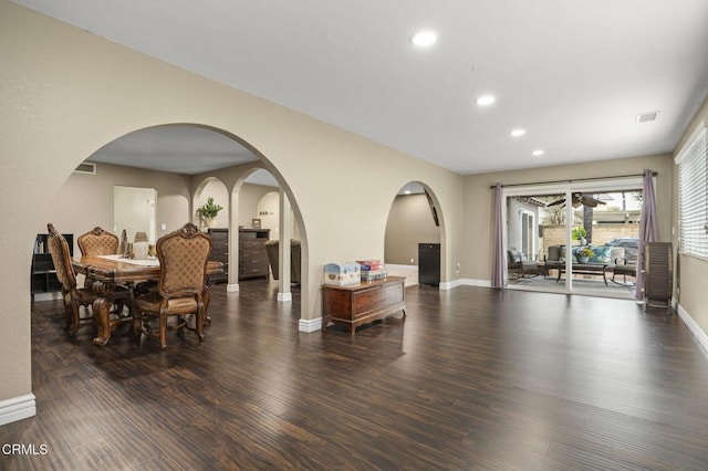 dining space with dark wood-type flooring