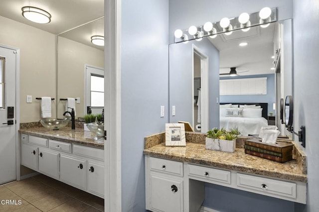 bathroom featuring ceiling fan, vanity, and tile patterned flooring