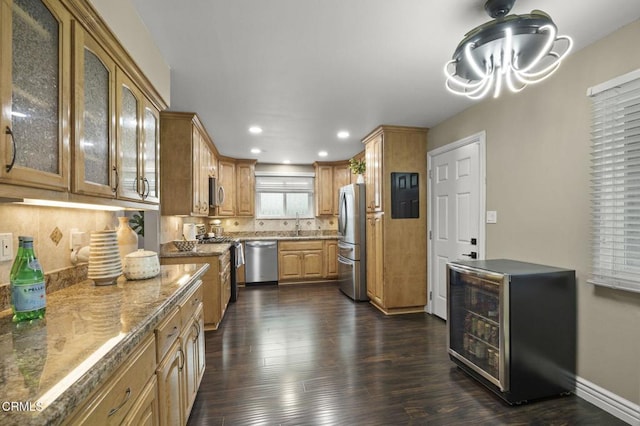 kitchen with sink, stainless steel appliances, dark hardwood / wood-style floors, wine cooler, and stone countertops