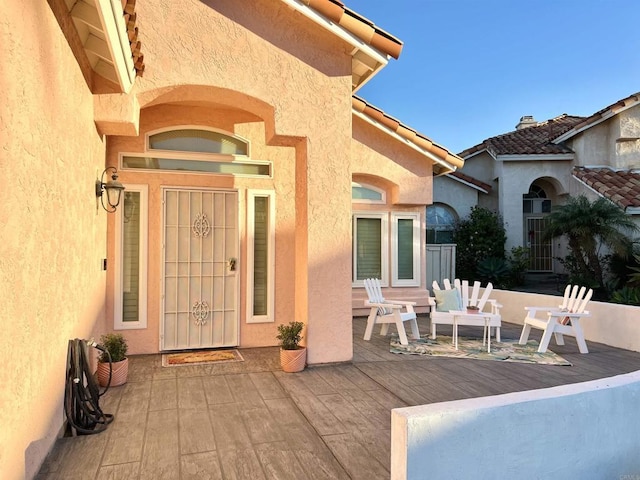 property entrance with a patio