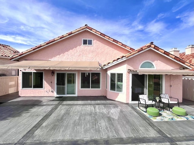 rear view of property with a deck