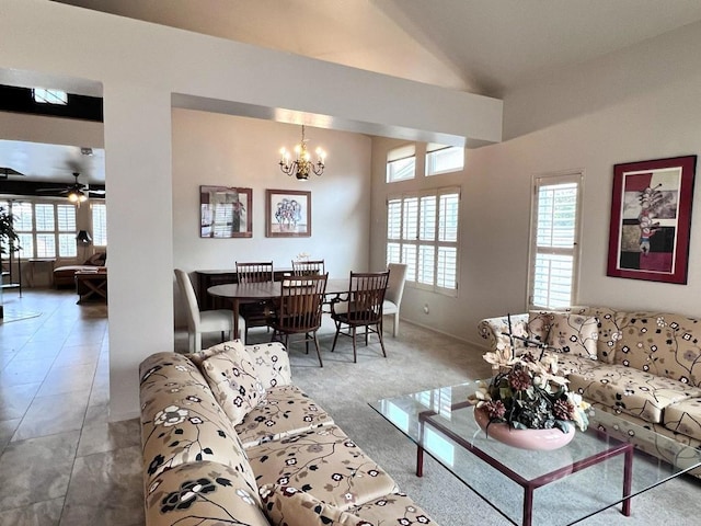 living room with lofted ceiling, ceiling fan with notable chandelier, carpet, and a wealth of natural light