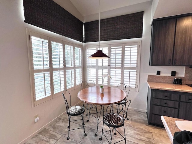 dining space featuring a healthy amount of sunlight and baseboards