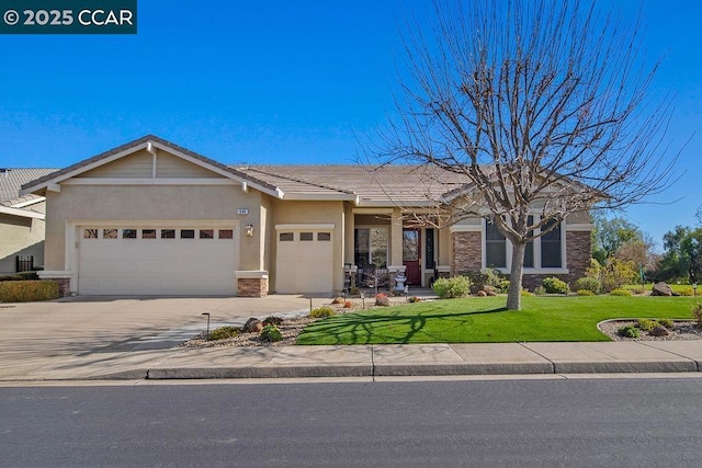 view of front of house featuring a garage and a front yard