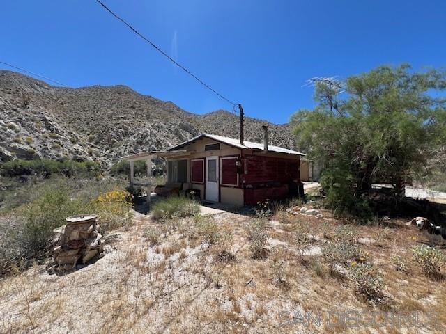 view of home's exterior with a mountain view