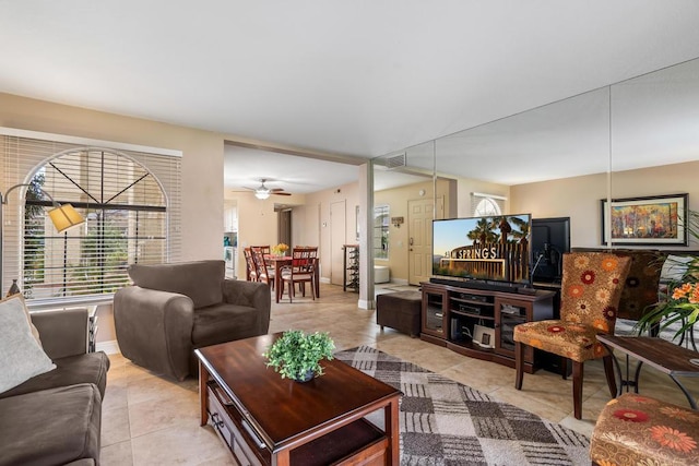 living room with light tile patterned floors and ceiling fan