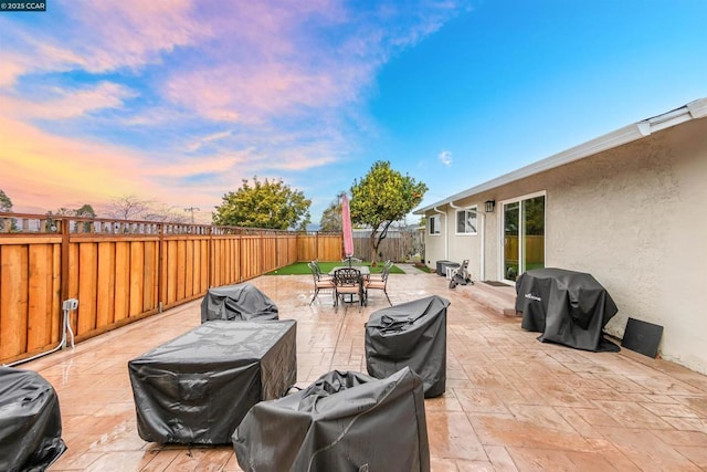 patio terrace at dusk with area for grilling