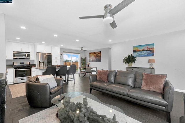 living room featuring ceiling fan