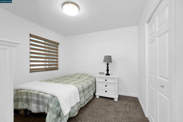 bedroom featuring dark carpet