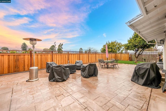 patio terrace at dusk with area for grilling