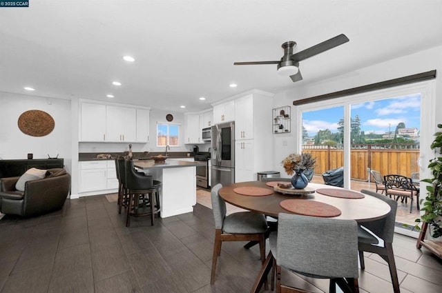 dining area with sink and ceiling fan