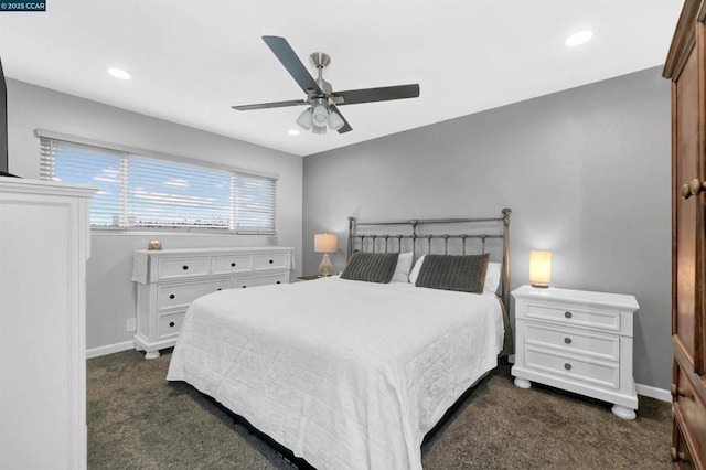 bedroom featuring ceiling fan and dark carpet