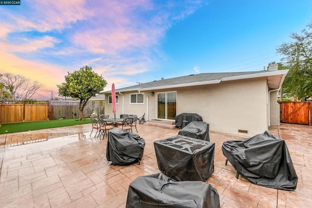 patio terrace at dusk with grilling area