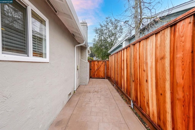 property exterior at dusk with a patio